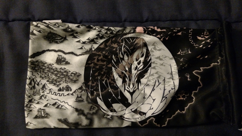 While the back side has this monochrome map/insignia design.